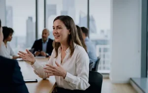 Developing Political Savvy and Workplace Influence 40 Professional woman speaking persuasively to colleagues in a boardroom