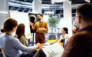 Body Language and Nonverbal Communication at Work 15 Presenter using open gestures while speaking to an engaged audience