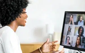 Agile and Scrum Methodologies for Project Teams 1 Smiling professional on a video call with several colleagues