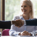 Banner image. African and caucasian millennial businessmen colleagues shaking hands on meeting in office, diverse enterpreneurs striking good deal, multiethnic teammates succeed in common project work - Influence Without Authority