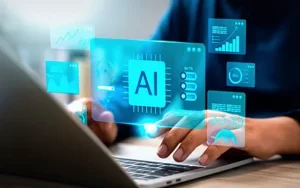 Introduction to AI for Business Professionals 21 Hands on a laptop keyboard with a glowing AI interface and data panels floating above the screen