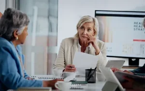 Behavioral Interviewing Skills for Federal Job Applicants 14 Interviewer reviewing papers while listening to a candidate across a table