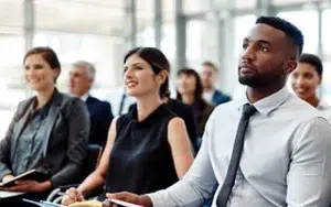 Business Ethics: Practical Principles for Ethical Decision-Making 24 Attentive professionals seated at a business conference