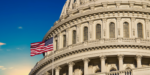 The U.S. Capitol building with American flag under a clear blue sky, symbolizing the federal workforce.