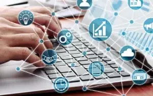 Applying Effective Upskilling Strategies 12 Hands on a laptop with connected skill and business icons