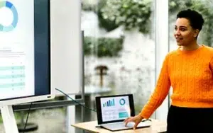 Effective Presentation Skills for Technical Professionals 50 Professional presenting a technical chart on a screen