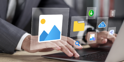 Business professional using a laptop surrounded by AI office-related icons and visuals representing document and spreadsheet tools.