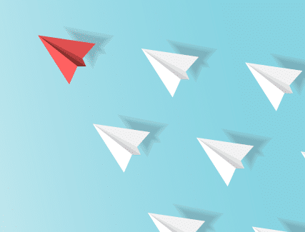 White paper airplanes following a red airplane representing leadership.