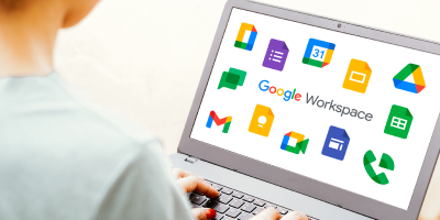 Business woman using multiple Google Workspace applications on laptop