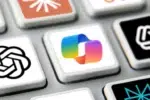 Microsoft Copilot: 10 Ways to Get Better Responses Every Time 19 Microsoft Copilot logo key on a silver keyboard surrounded by AI tool keys.