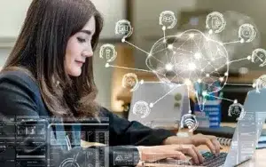 Creating AI Business and Leadership Agents with Copilot 16 Professional working on a laptop with a network of AI agent icons around a digital brain
