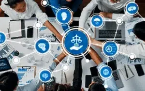 AI Ethics, Risk Analysis and Governance for Organizations 4 Team at a table connected by digital icons for ethics, governance and AI risk