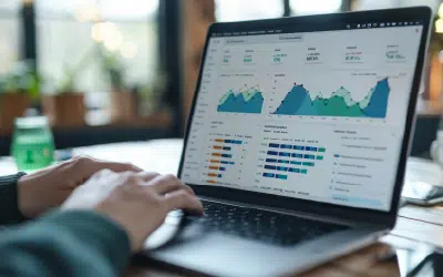 Person analyzing data on laptop screen