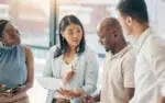 Group of business professionals collaborating in a B2B team training course