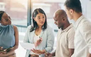 Group of business professionals collaborating in a B2B team training course