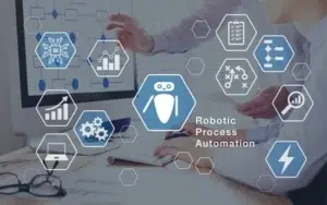 Human–Super Intelligence Collaboration in Federal Workplaces 31 Robotic process automation icons with a robot, workflow and analytics symbols over an office desk