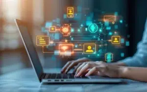 Super Intelligence-Powered Communication Series 50 Hands typing on a laptop with glowing communication, profile and data icons connected in a network